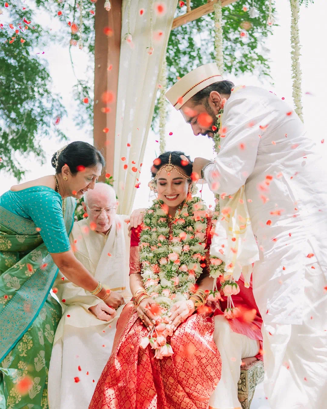 A bride smiling during her traditional wedding ceremony